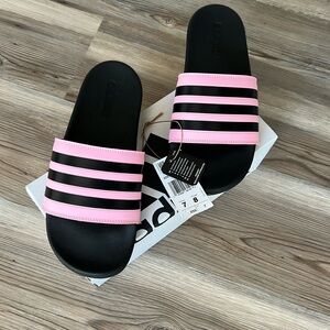Adidas, pink and black slides. Size men’s 7/women’s 8. Brand new in box with tag